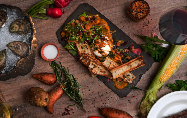 Wooden table with various appetizer.